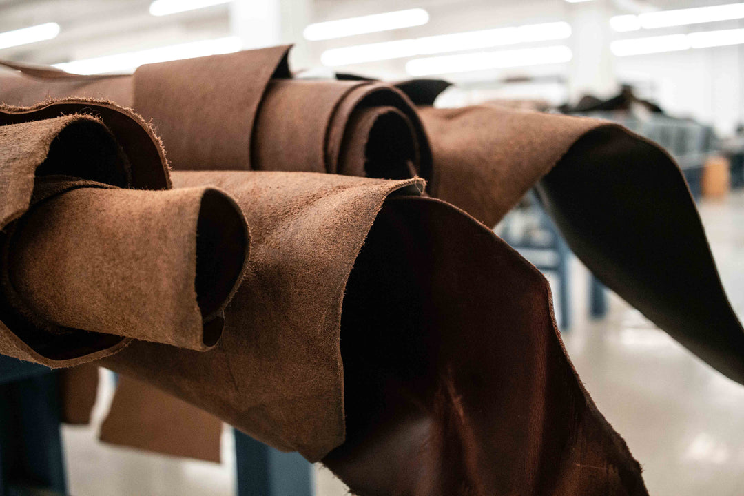 Rolls of roughout leather stacked and ready to be cut