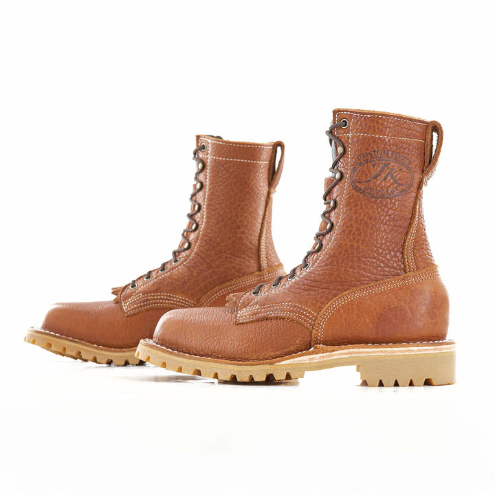 Side view of a pair of OT Canyon Bison leather work boots on a white background