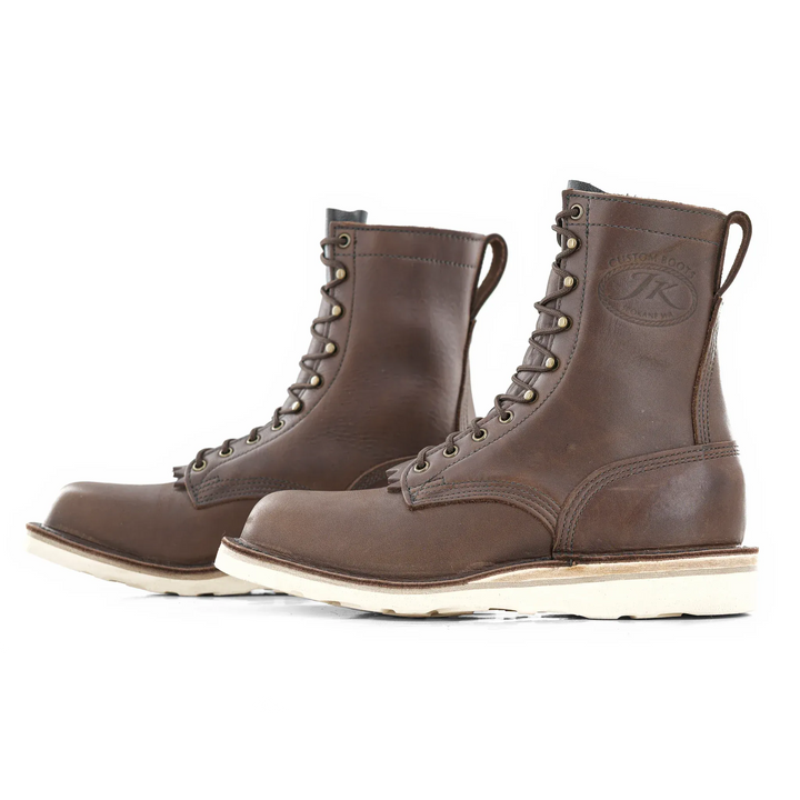 Side view of a pair of Forefront 8 inch brown leather work boots on a white background