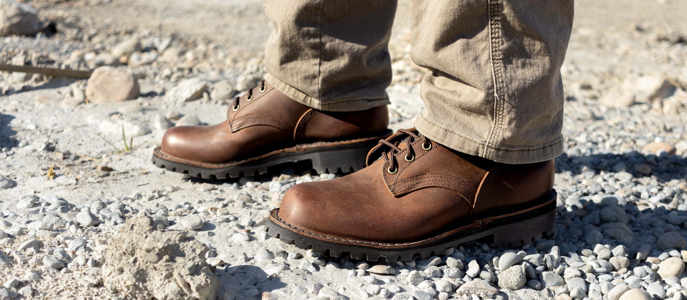 jk boots safety toe brown boots standing on gravel