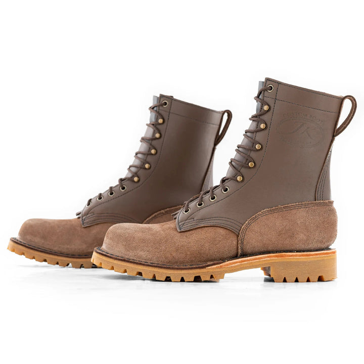 Side view of a pair of OT Mocha leather work boots on a white background