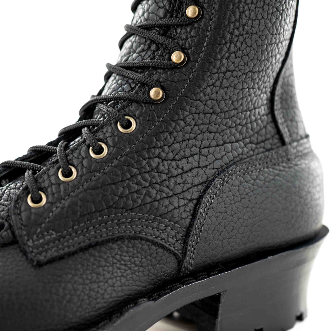 Lower quarter and counter side view of a Superduty shadow bison leather work boot