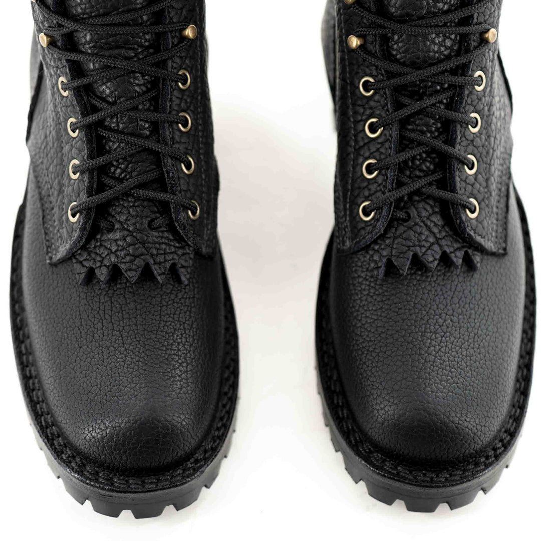 Top view of laces, vamp and toes of a pair of Superduty shadow bison leather work boots