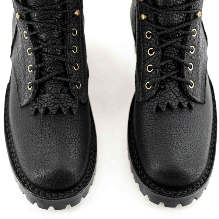Top view of laces, vamp and toes of a pair of Superduty shadow bison leather work boots