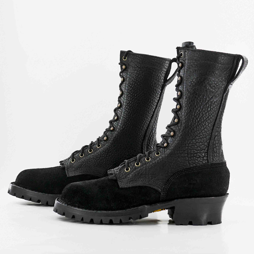 Side view of a pair of Superduty Shadow Bison rough leather work boots on a white background