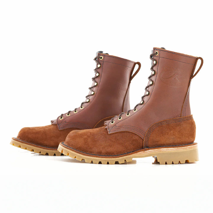 Side view of a pair of OT Redwood rough leather work boots on a white background