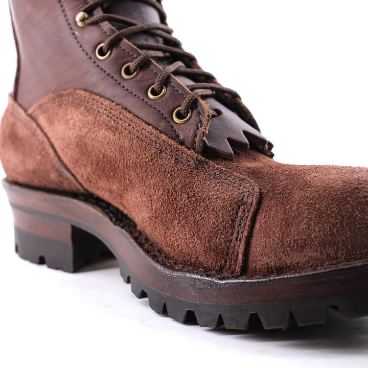 close up image of the Climber - Brown showing the contrast between the smooth/rough leather and the stitching at the sole of the boot.