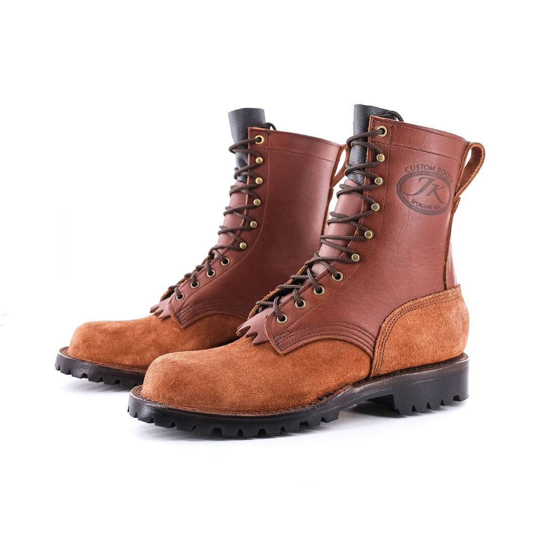Side view of a pair of OT Pro Redwood leather work boots on a white background