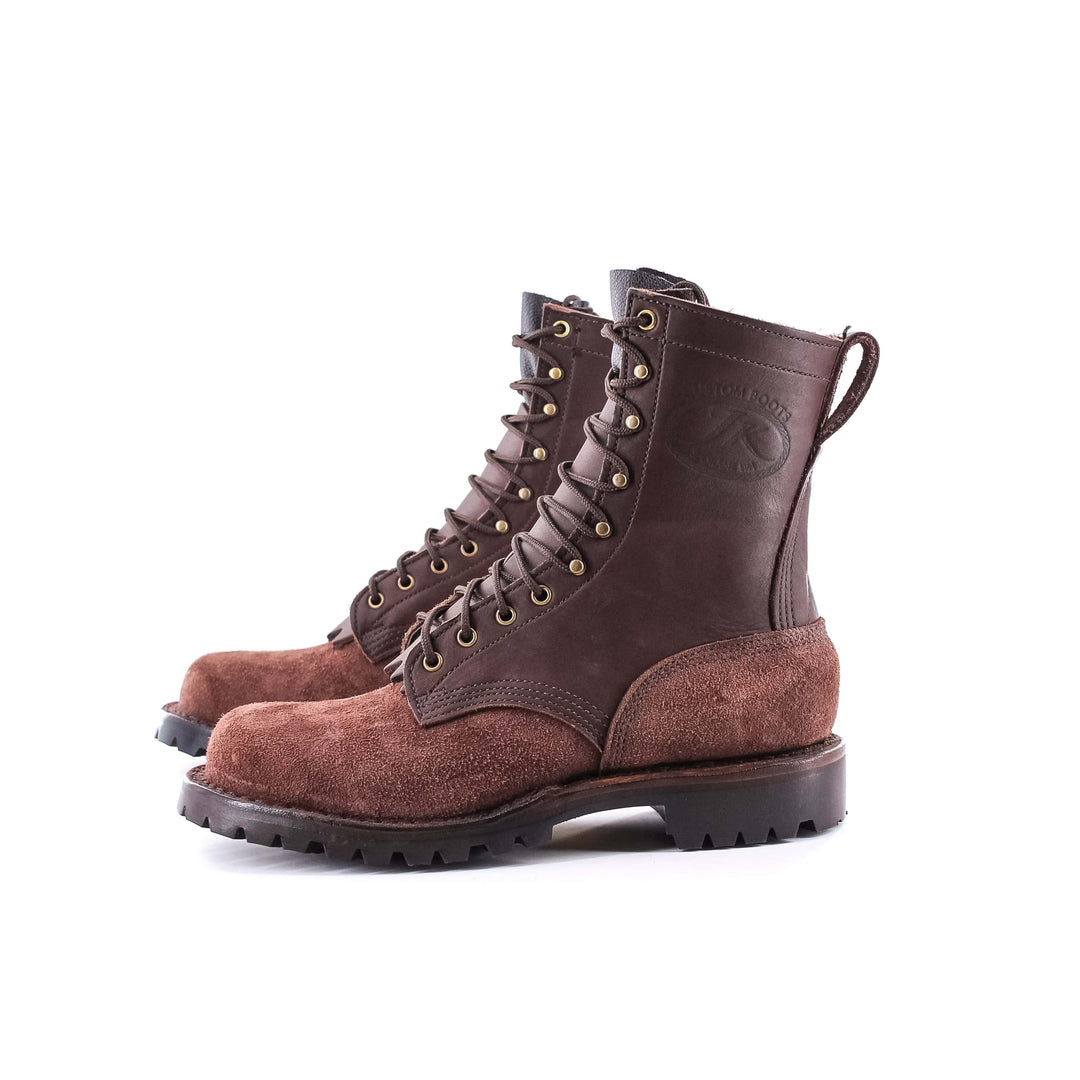 Side view of a pair of OT Pro Brown leather work boots on a white background